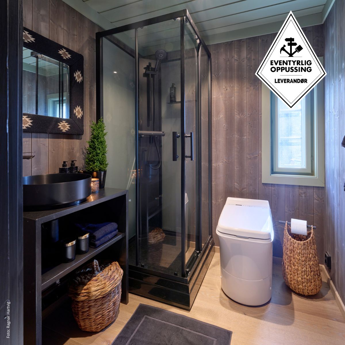 Modern bathroom with shower, toilet, and wooden walls.