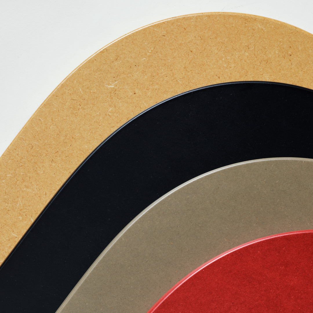 Toilet lids in different colors on a white background